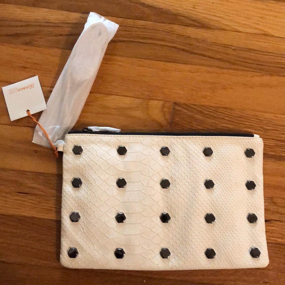 New ivory punchcase wristlet